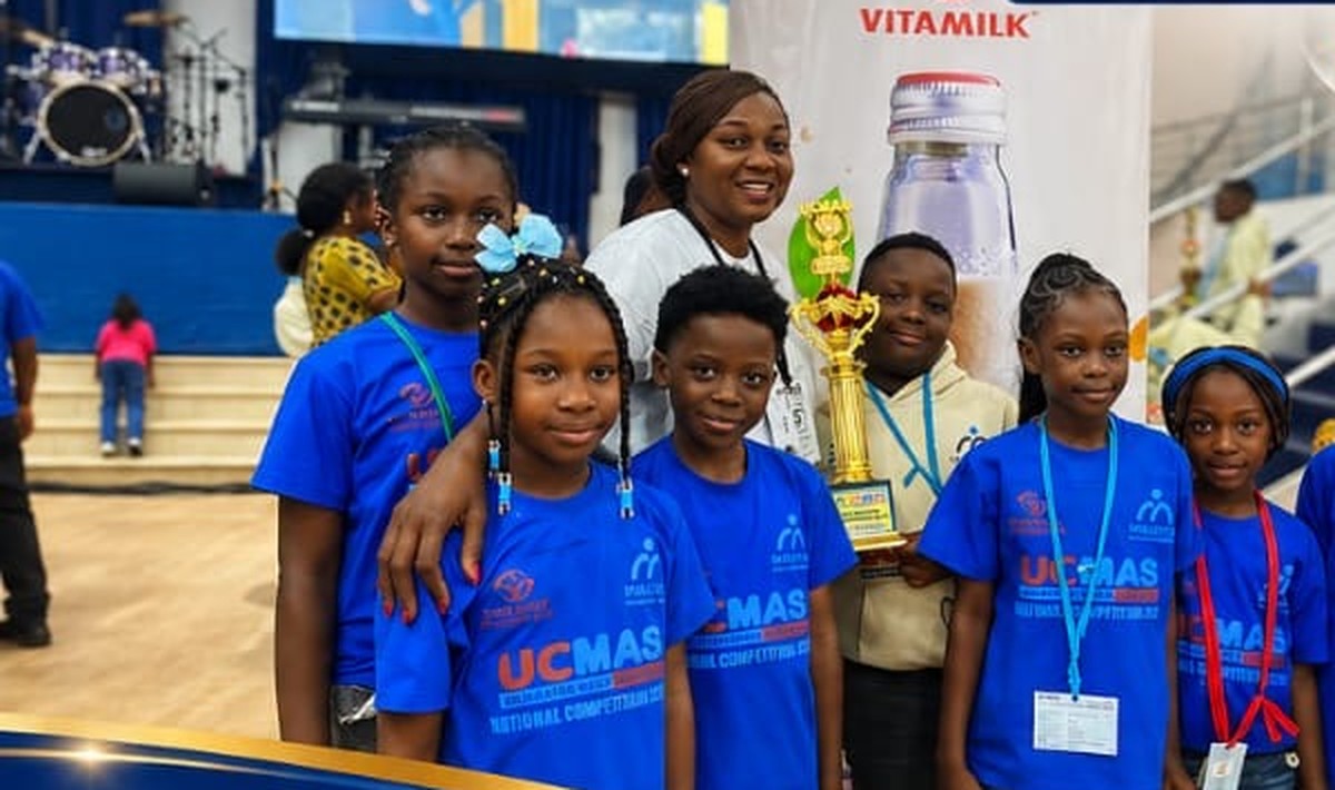 Seven Regina Mundi pupils posing with their trophy and UCMAS banner at the 2026 UCMAS National Competition